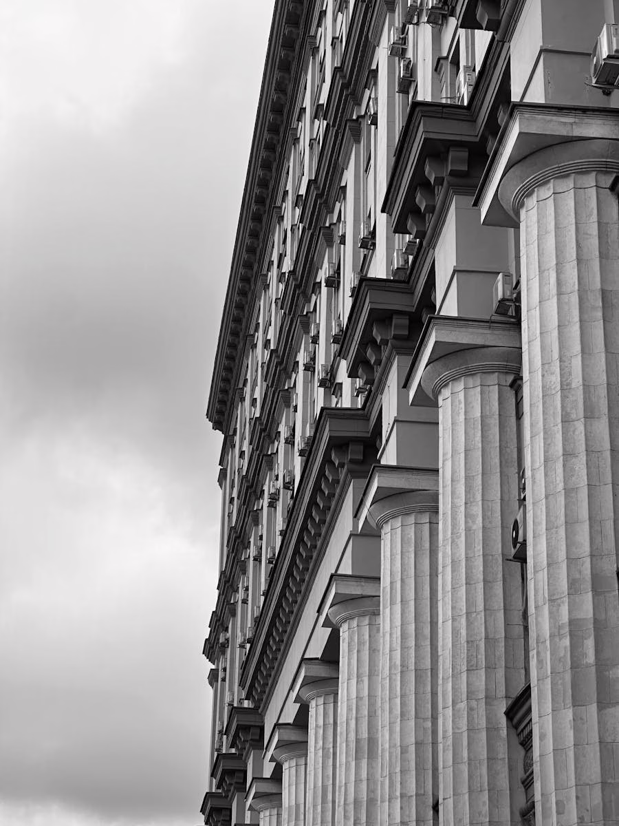 Black and white image showcasing classical architectural columns on a historic building.